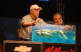 Co-angler Doug Caldwell had the honor of weighing the first fish in the Austin Convention Center.