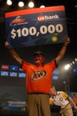 Mark Davis holds up a check for $100,000 after winning his first FLW Tour event.
