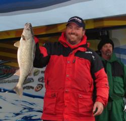 Pro Scott Fairbairn holds up his biggest walleye from day two on the Detroit River.
