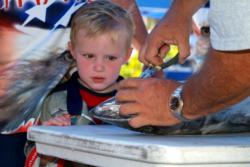 Four-year-old Austin Biddix of Team Strategix gets an eyeful at the bumper