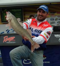 Fort Pierre, S.D., pro Gerrick McComsey holds up a huge walleye he caught on day four.