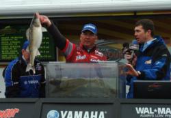 Pro winner Mark Meravy holds up a Detroit River walleye.