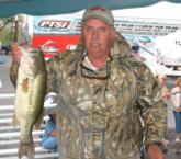 Co-angler Doug Caskey shows off the biggest bass of his day-one catch that weighed 13-10, good for sixth.