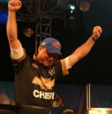 Kevin Wells throws his hands in the air upon being named All-American co-angler champion.