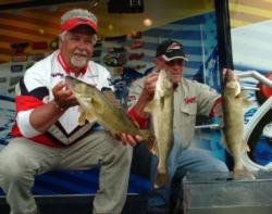 Pro John Renschen and co-angler Larry Oleson hold up part of their day-one limit.