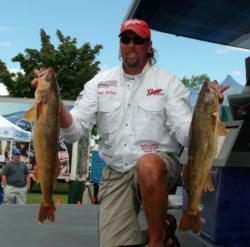 Pro Paul DeVoss shows off part of his 20-pound, 1-ounce catch. DeVoss is in second after the opening day. 