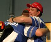 Newly crowned Angler of the Year Jay Yelas, right, gets a hug from his roommate and fellow AOY contender Mark Davis.