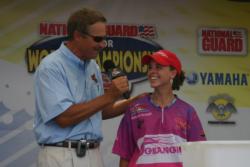Delaney Broggi of Rhode Island talks her day over with Hank Parker. Broggi finished the day in 33rd place.