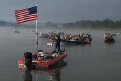 In the starter boat, FLW Outdoors staffer Duane Link addresses Stren Series competitors during the fog delay on day two at the Hudson River.