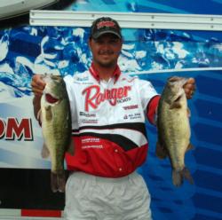 Oklahoma pro Jason Christie holds up two Lake of the Ozarks lunkers.