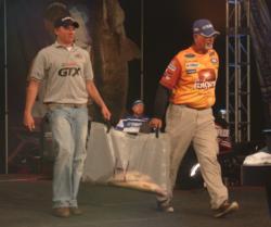 Pro Dennis Lantzy and co-angler Patrick Bertelsen haul their day-three catch to the scale.
