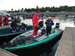 Castrol pro Bobby Curtis of Siloam Springs, Ark. goes over his day-two game plan with his co-angler.