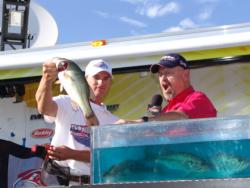 Bo Middleton shows off one of the big bass that secured his co-angler victory.