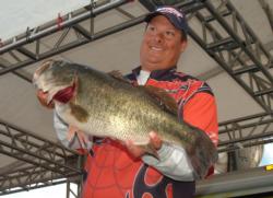 Fred Contaoi holds up the Snickers Big Bass from the Pro Division Friday. This fish weighed 11 pounds, 1 ounce.