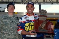 Tim Klinger, a member of Team National Guard, accepts his winner