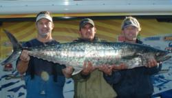 Team Hooligan shows off their 47-pound, 15-ounce catch. The team, which zeroed in yesterday's competition, qualified for the Kingfish Tour Championship finals in third place.