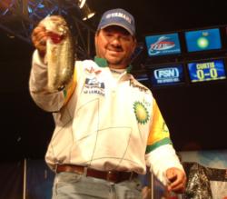 David Curtis holds up his biggest bass from day three on the Mobile Delta. The Trinity, Texas, native is second with 9 pounds, 8 ounces.