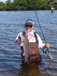 Ron Hueston of Miami shows off a nice winter redfish that he caught wading backwater holes in Charlotte Harbor.