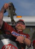 Co-angler Bill Dunn shows of his tournament winning fish.