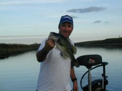 TBF Living The Dream winner Dave Andrews shows off his early morning topwater catch at Lake Okeechobee.
