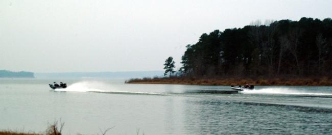 Boats throttle out of the no-wake zone on Sam Rayburn Reservoir on the final day of the Stren Texas event.