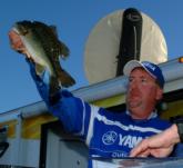 Co-angler Rich Dalbey weighs one of the fish that earned him the Stren Texas win on Sam Rayburn.