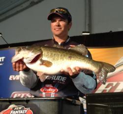 Pro Randy Hadden holds up the Snickers Big Bass from day one on Lake Toho. This monster weighed 11 pounds, 9 ounces.