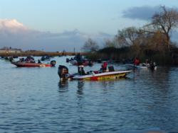 Anglers in later flights mill around the Russo Marina basin as they await their takeoff.