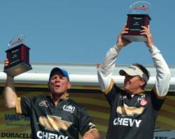 Geoffrey Page of Venice, Fla., and Terry Brantley of Arcadia, Fla., hoist their first-place trophies at the FLW Redfish Series event in Sarasota, Fla.