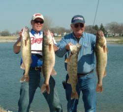 Pro John Swanstrom and co-angler Larry Behsman hold up their 45-pound, 13-ounce catch.