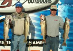 Larry Stephen Smith and Keith Strauss hold up their day-three catch.