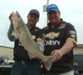Larry Stephen Smith and John Kopcok hold up their biggest walleye from day four.