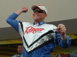 Pro John Swanstrom celebrates after finding out he won the season-opening FLW Walleye Tour event on Lake Erie.