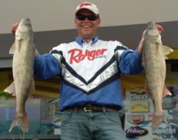 Pro champion John Swanstrom holds up his two biggest walleyes from Saturday