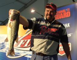Pro Bill Day shows off his 5-pound, 7-ounce largemouth that held up as the Snickers Big Bass of the day.