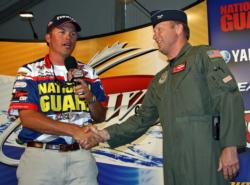 National Guard pro Scott Martin thanks Colonel Tim Dearing of the Air National Guard for allowing him to join a midair training mission aboard a KC-135 refueling plan a day before the tournament.