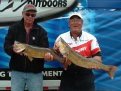 Pro Kim Papineau and co-angler James Weiss hold up their two overs from day three. 