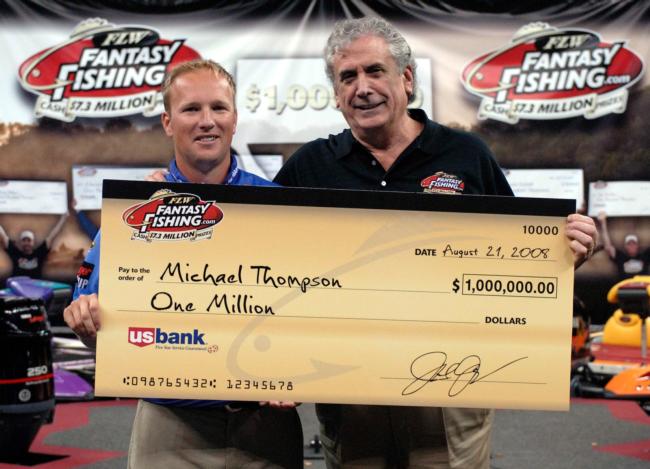 FLW Fantasy Fishing creator and FLW Outdoors Chairman Irwin Jacobs presents a $1 million check to the champion of the inaugural fantasy season, Michael Thompson.