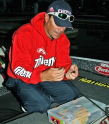 National Guard pro Tim Klinger rigs a bait while waiting for the day two check out.