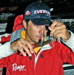 RJ Bennett, who enters day four in third place, adjusts one of his spinnerbaits prior to launch.
