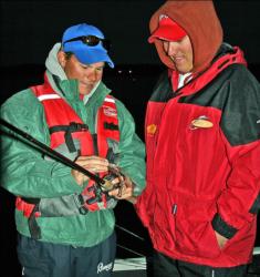 In the seventh place boat, co-angler John Woodruff discusses bait strategies with his pro partner Brian Stack.