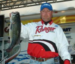 Texas pro Toby Hartsell holds up the Snickers Big Bass from day two on Table Rock Lake. Hartsell