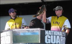 LSU students carefully weigh in their catch.