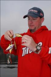 Snickers pro Greg Pugh wrestles with a pile of rattling lipless crankbaits: the premium lure for fishing Lake Guntersville in cold water.