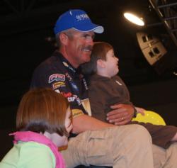 Texas pro John Tanner relaxes in the Chevy boat with his children after weighing in a 15-pound limit. 