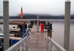Anglers bow their heads in prayer before takeoff on Clear Lake.