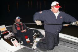 Pro Randy McAbee Jr. prepares his rods in the No. 2 boat as co-angler Kyle Baker awaits the final day of competition in the Stren Western season opener on Clear Lake.