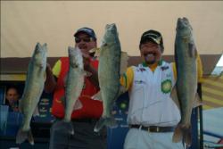 Ted Takasaki and his co-angler, Bruce Frevert, show off the catch that landed Takasaki in second place with 91 pounds, 4 ounces. Frevert finished third in the co-angler division with 92 pounds, 15 ounces
