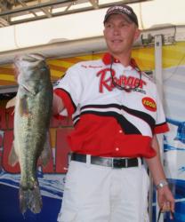 Pro Andy Montgomery holds up a 5-pound, 4-ounce Lake Norman largemouth, the heaviest bass of the tournament thus far.