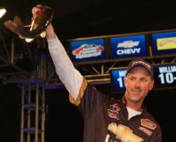 Second-place pro Andy Morgan holds up his kicker bass from day four on Lake Norman.